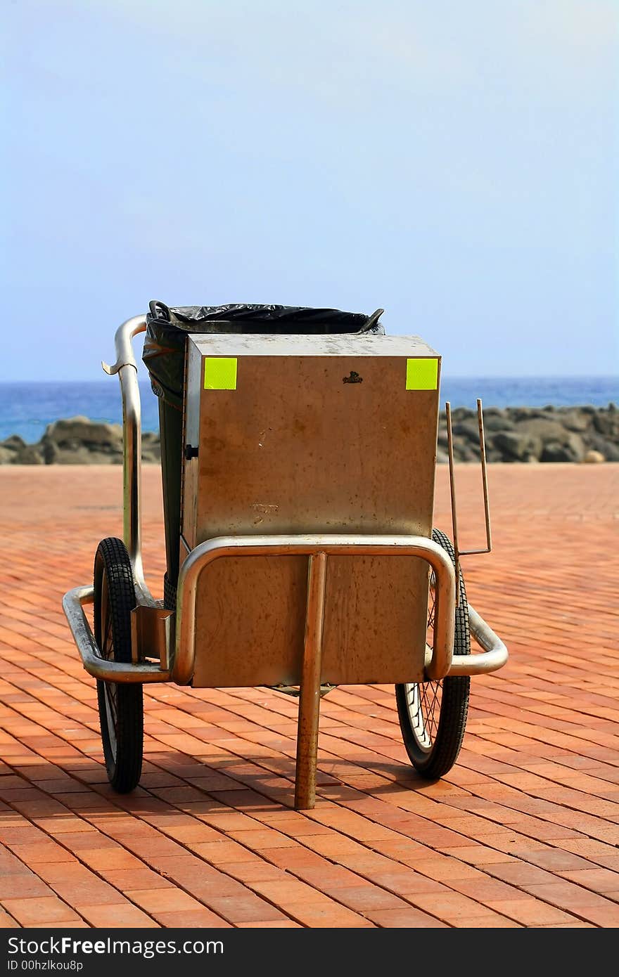 Steel garbage collector near the beach. Steel garbage collector near the beach