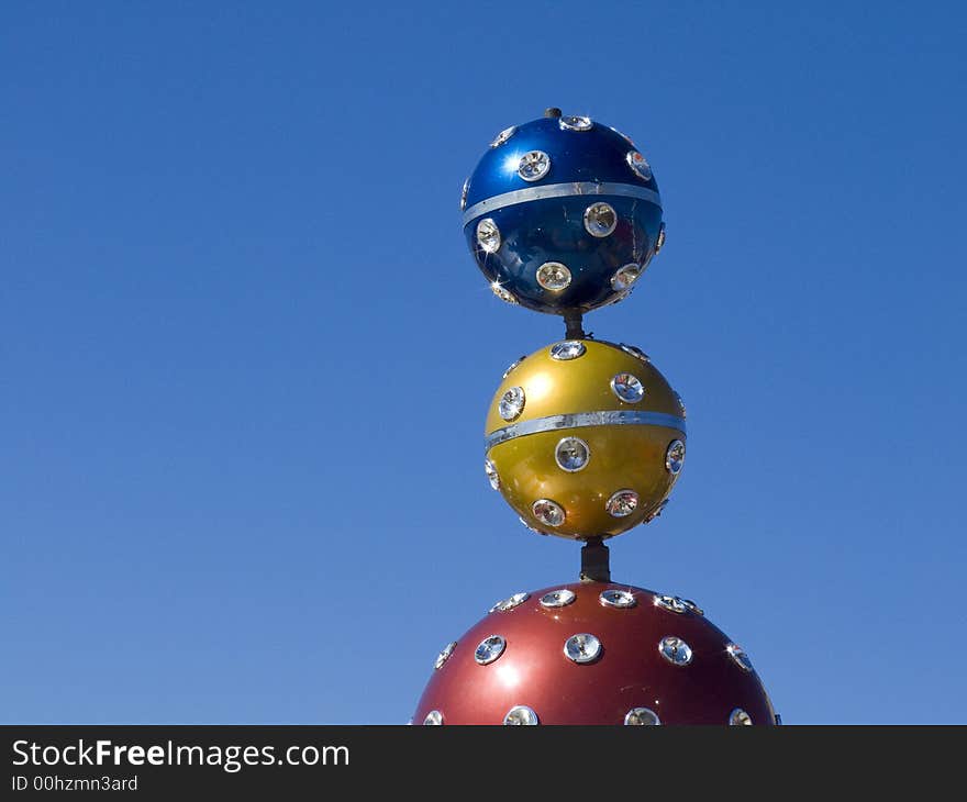 Colored balls with spotlights on a fairground in south france