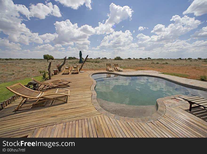 Luxury pool with sunbeds on the middle of the desert. Luxury pool with sunbeds on the middle of the desert