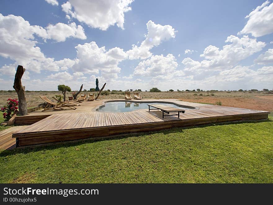 Luxury pool with sunbeds on the middle of the desert. Luxury pool with sunbeds on the middle of the desert