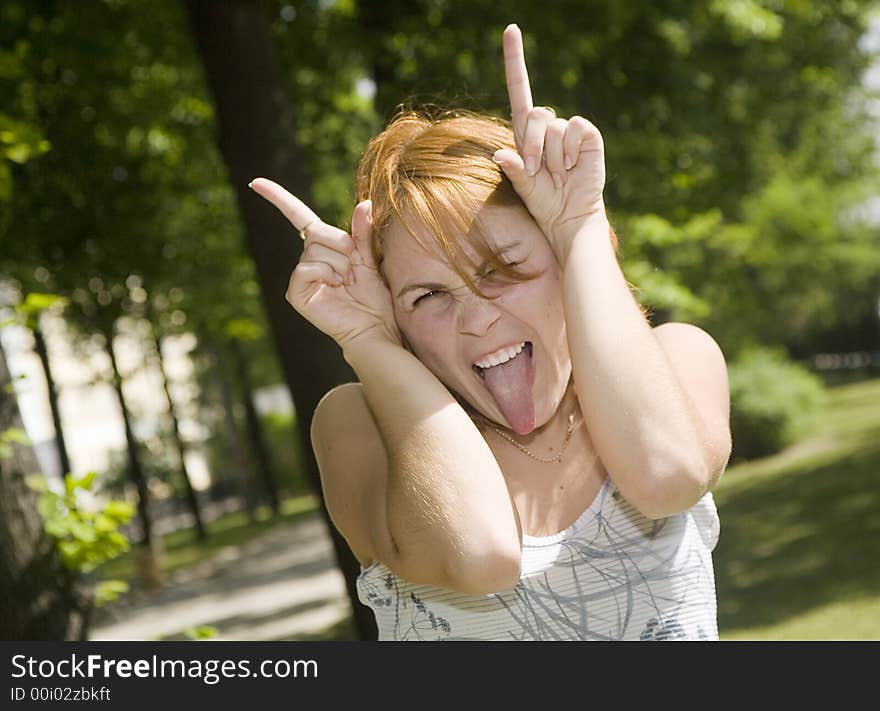 Red girl is posing for camera. Red girl is posing for camera