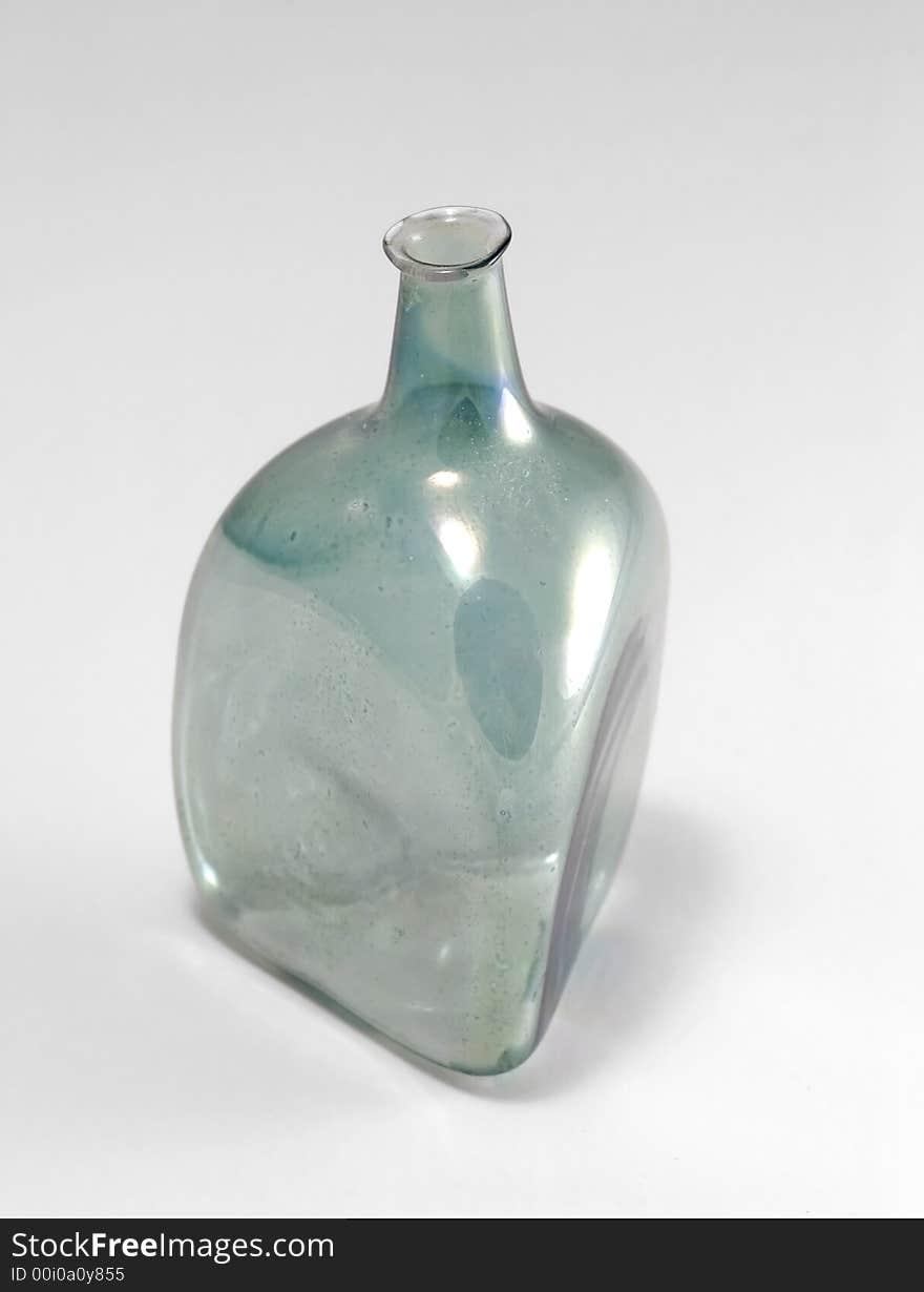 Ancient glass bottle isolated on gray. Ancient glass bottle isolated on gray