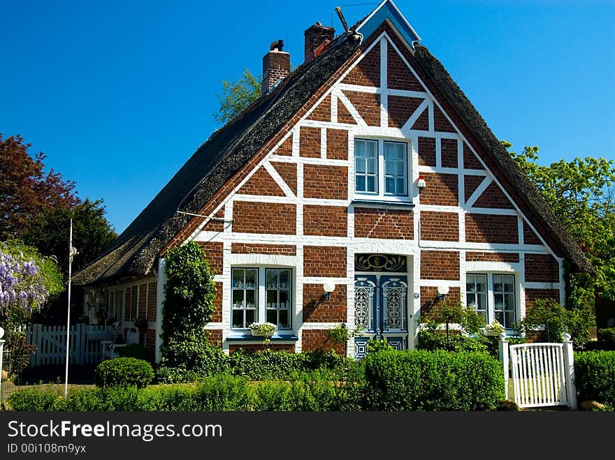 Old gable of a thatched cottage in northern Germany