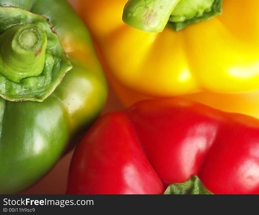 A closeup on three bell pepper: red, yellow, green. A closeup on three bell pepper: red, yellow, green