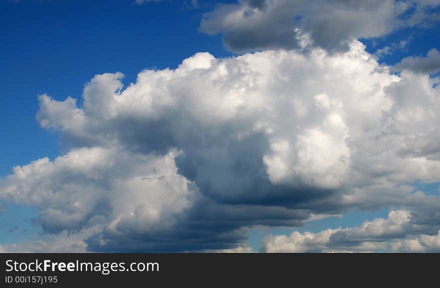 Big white clouds on deep blue sky. Big white clouds on deep blue sky