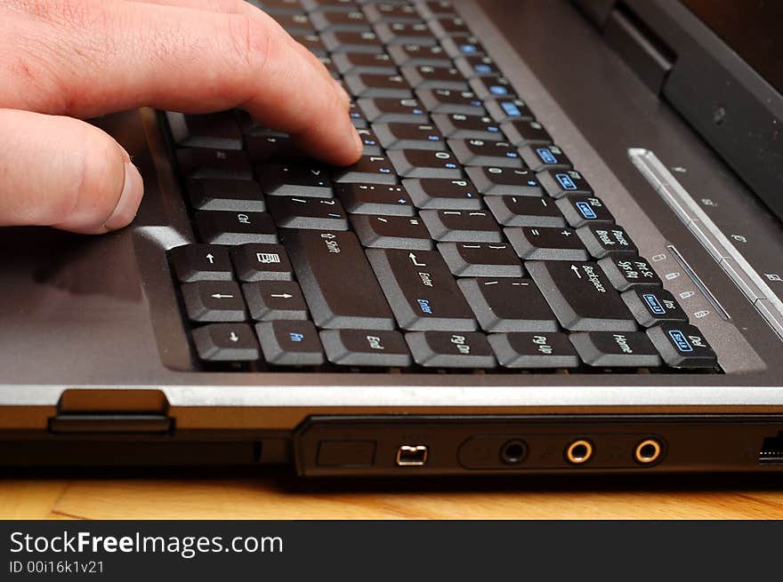 Close-up of silver laptop with black keyboard. Close-up of silver laptop with black keyboard