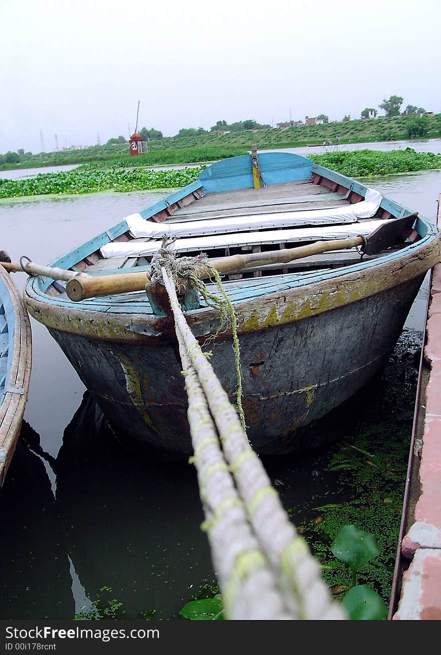 A wooden Indian boat on the bank of Gomti in India