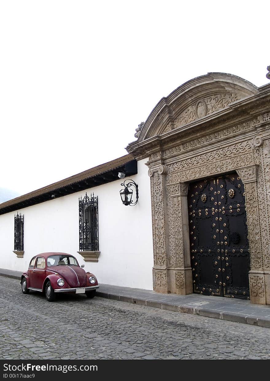 A bright volkswagen beetle at mexico's typical streets