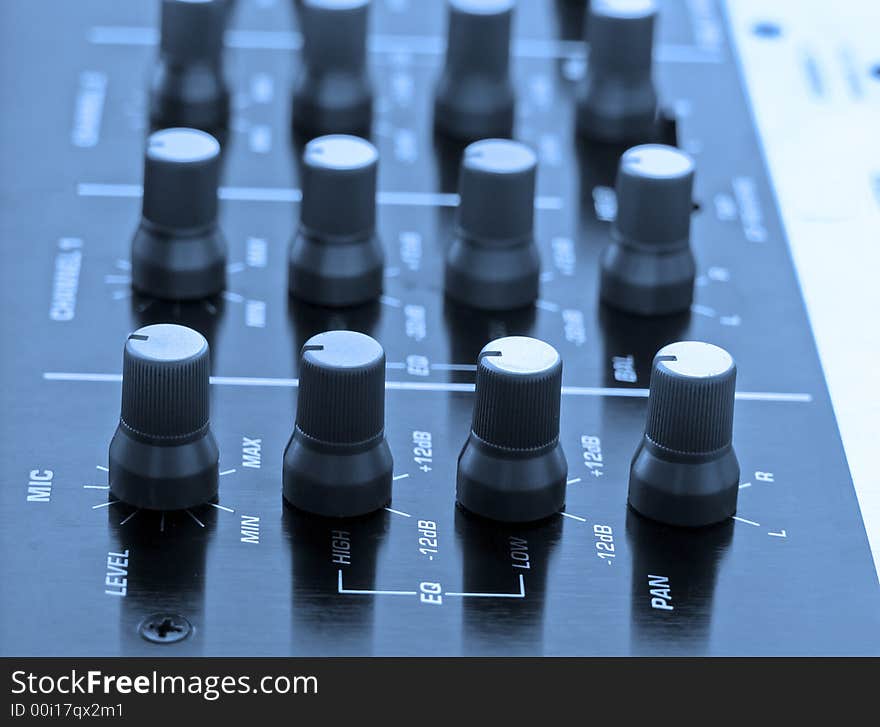 Professional DJ mixer with blue tone. Professional DJ mixer with blue tone