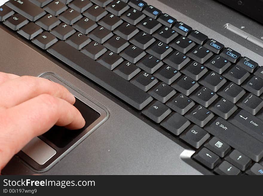 Close-up of silver laptop with black keyboard. Close-up of silver laptop with black keyboard