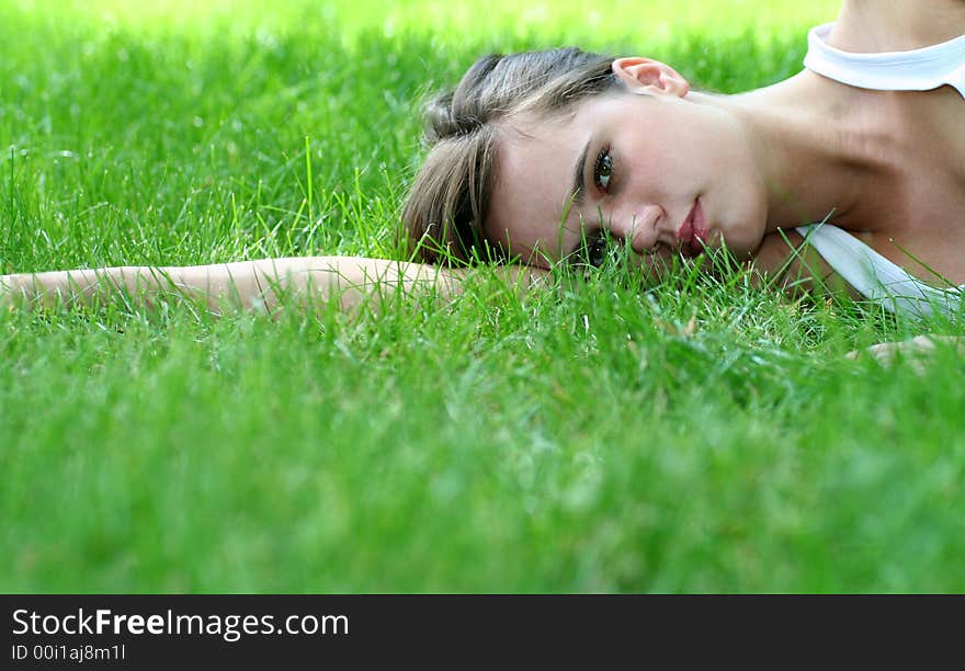 Woman Lying On Grass