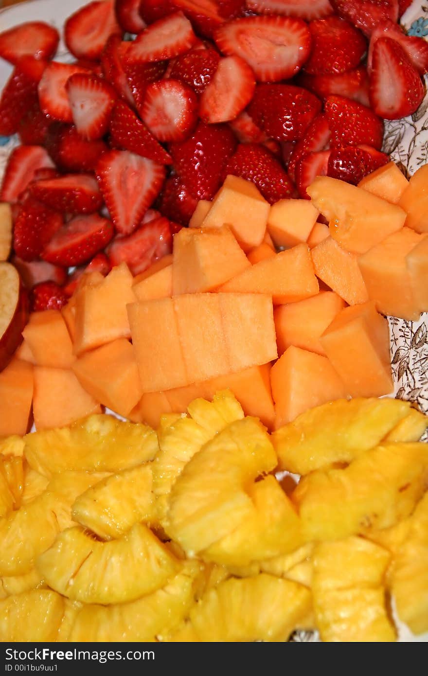 A colorful tray full of fresh cut fruit. A colorful tray full of fresh cut fruit