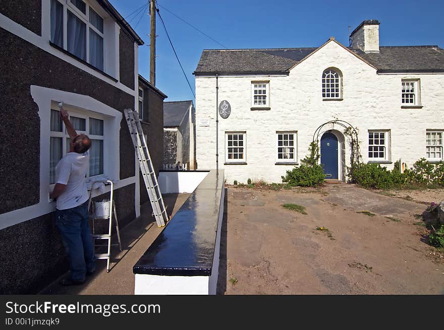 Painter at work, welsh town