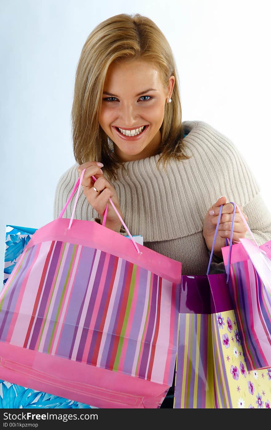 Happy young woman with bags. Happy young woman with bags