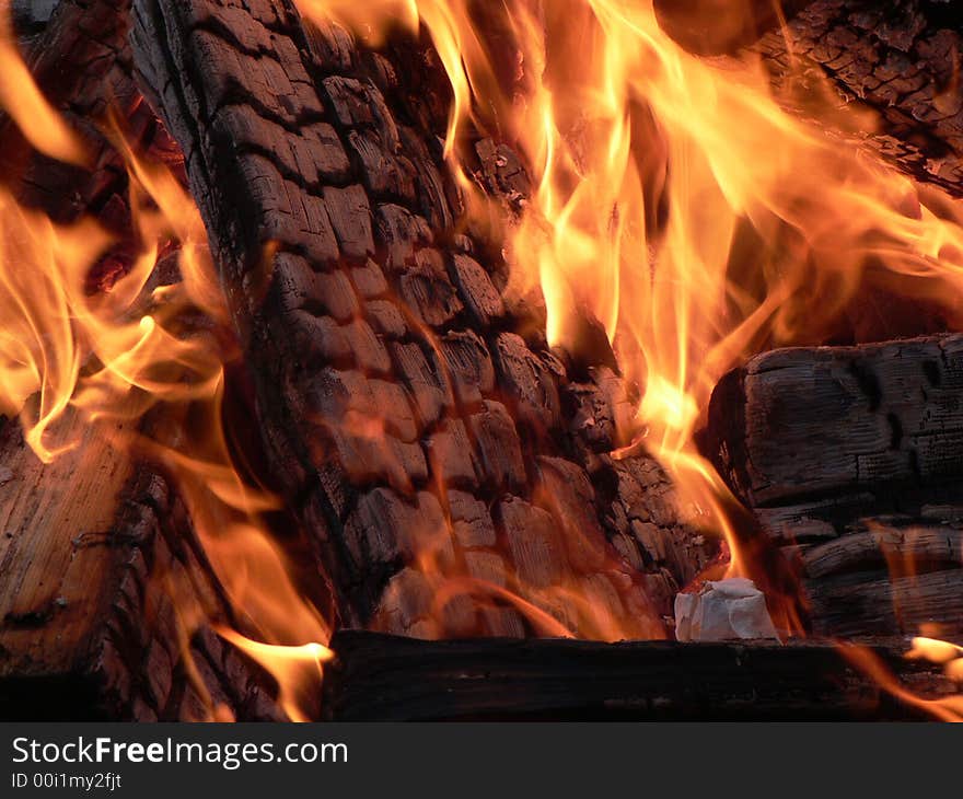 A macro shot of burning wood. A macro shot of burning wood