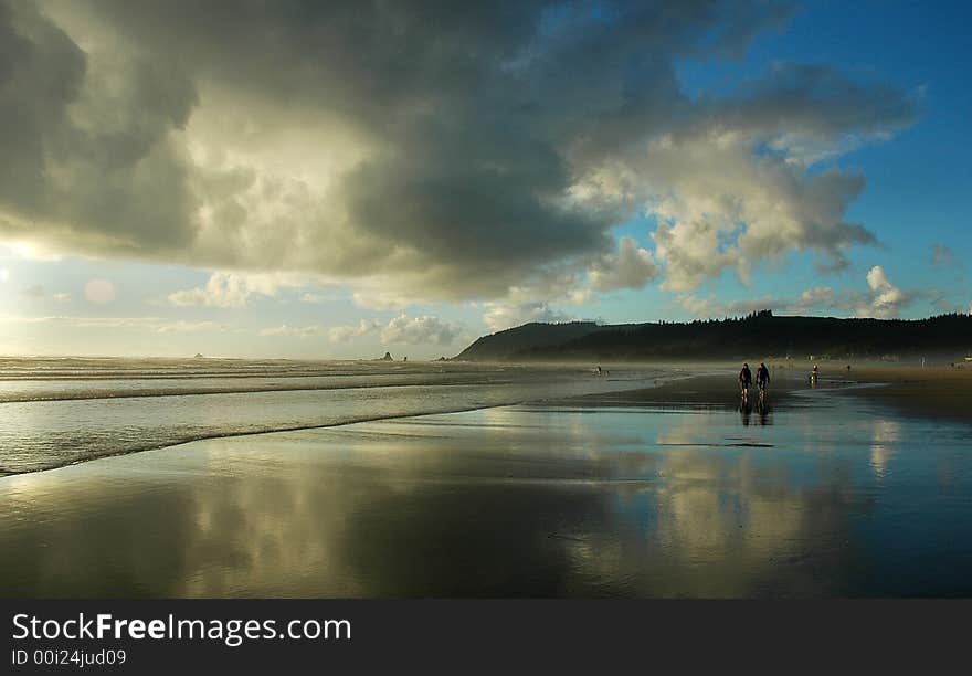 Colorful reflections off the beach with dramatic clouds. Colorful reflections off the beach with dramatic clouds