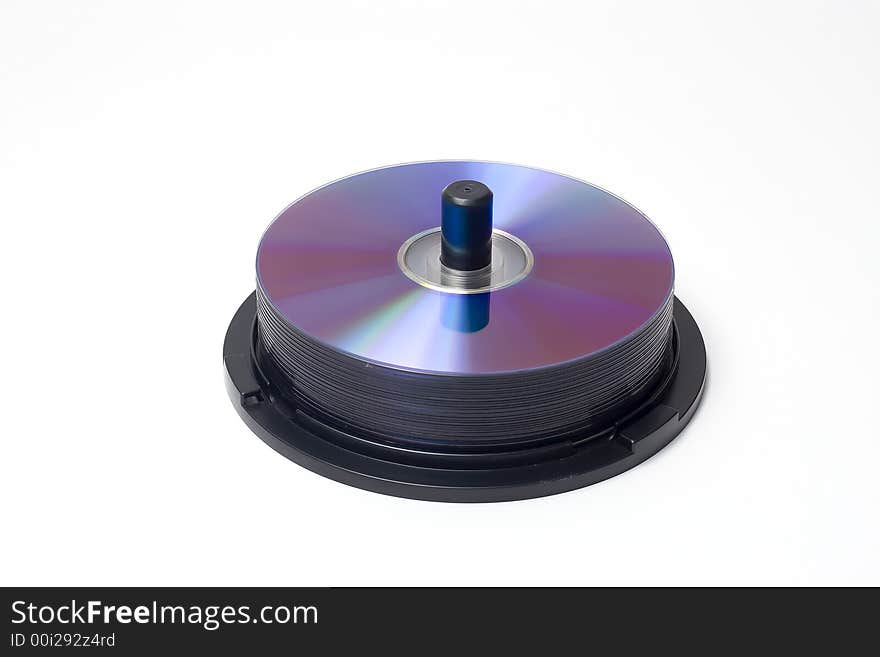 A spindle containing a piles of cd's/dvd's. A spindle containing a piles of cd's/dvd's