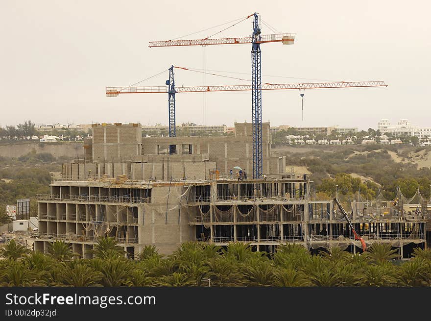 Workers is building a hotel. Workers is building a hotel.