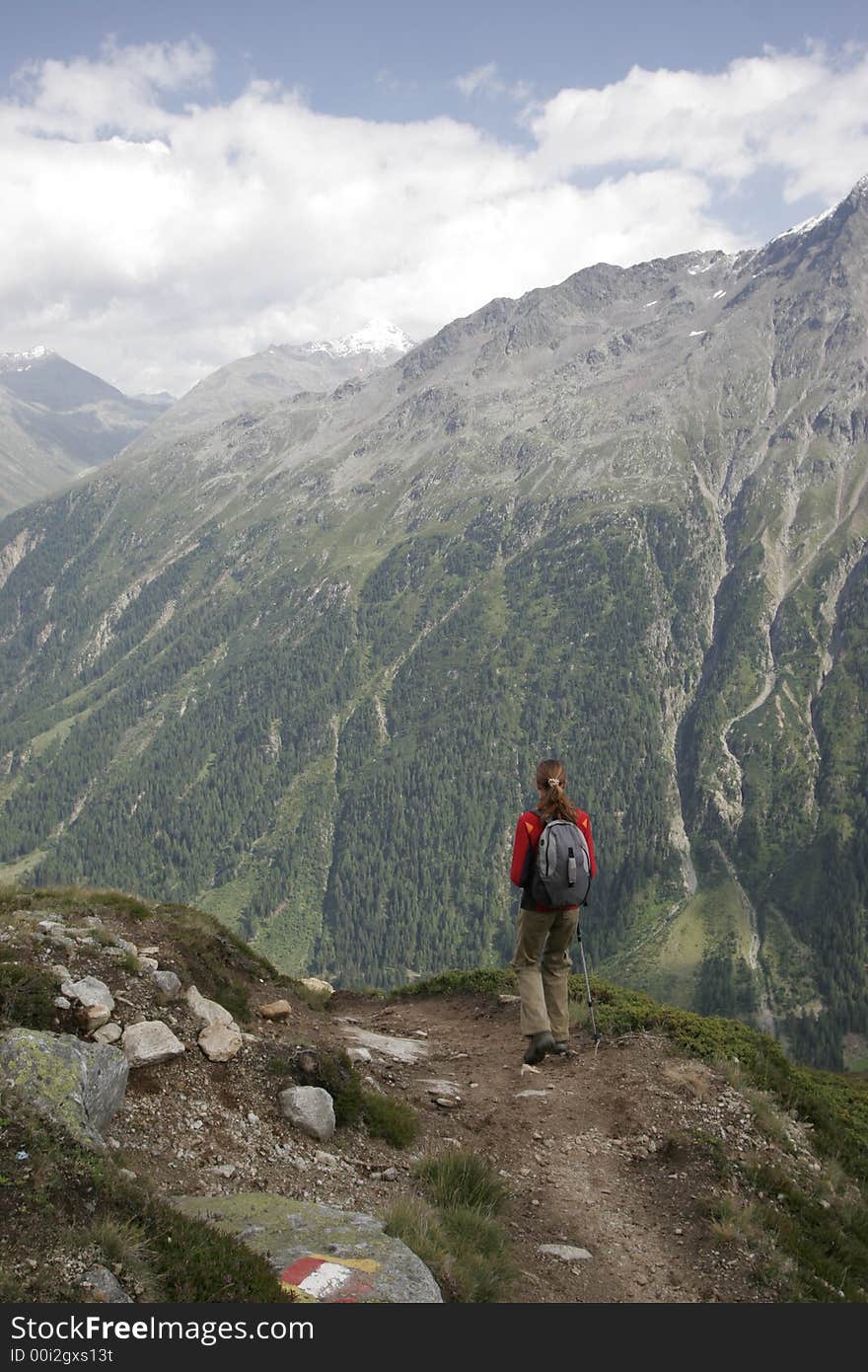 Young woman going downhill in alps. Young woman going downhill in alps