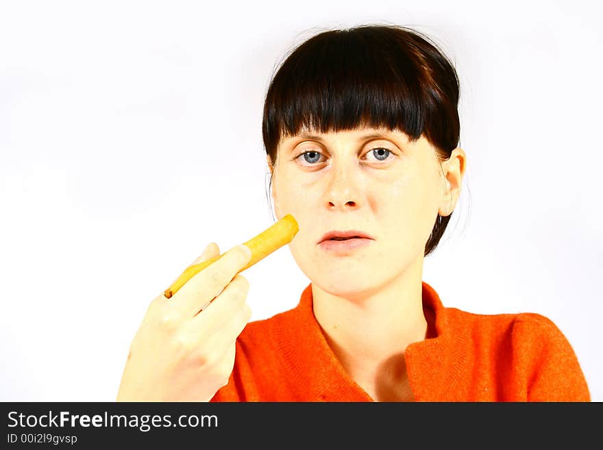 Young beautiful girl eating fresh orange. Young beautiful girl eating fresh orange