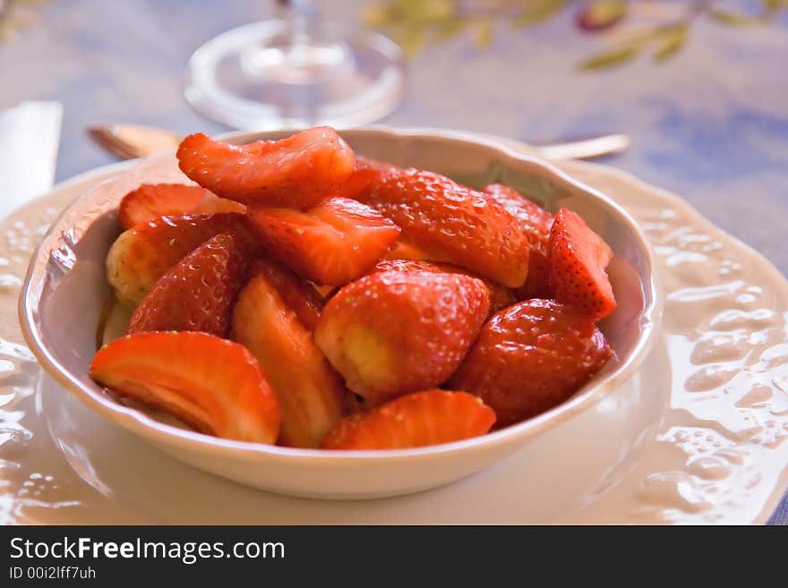 Plate of strawberries on a table. Plate of strawberries on a table