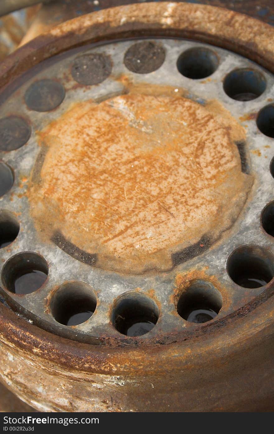 Some rusty machinery with holes. Some rusty machinery with holes