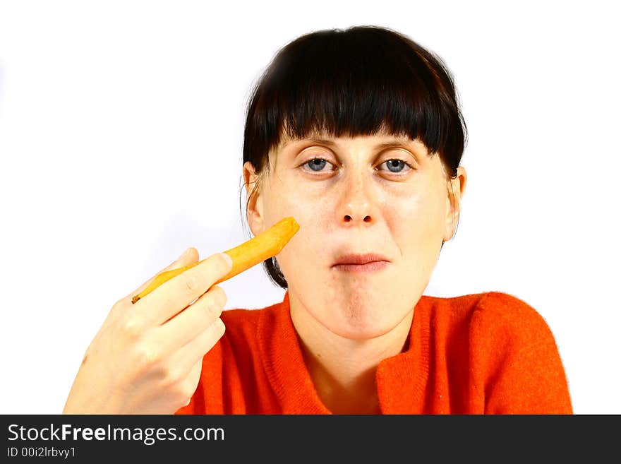 Young beautiful girl eating fresh orange. Young beautiful girl eating fresh orange