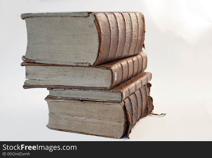 Ancient books are standing on the shelf. Ancient books are standing on the shelf