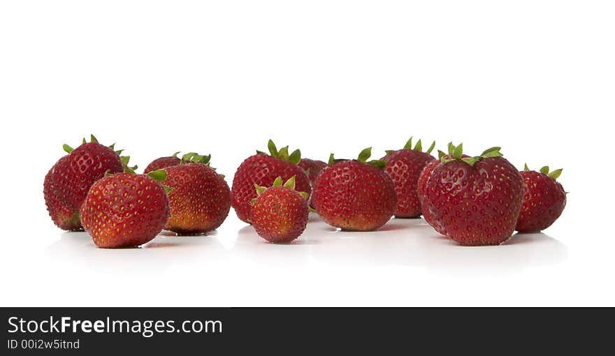 Colorful strawberries isolated over white background