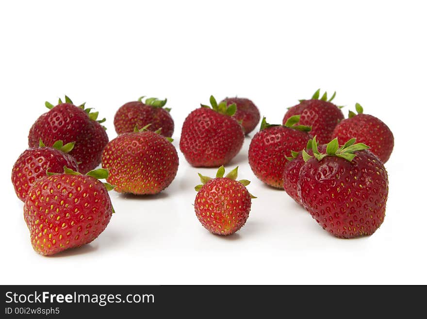 Colorful strawberries isolated over white background