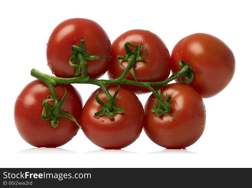 Bunch of red tomatoes over white background