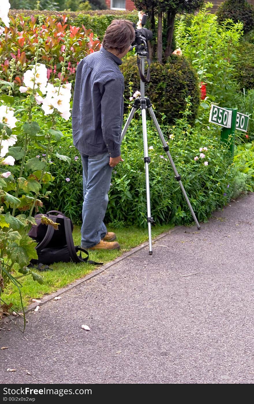 Professional Photographer getting ready with Tripod for Photo shoot. Professional Photographer getting ready with Tripod for Photo shoot