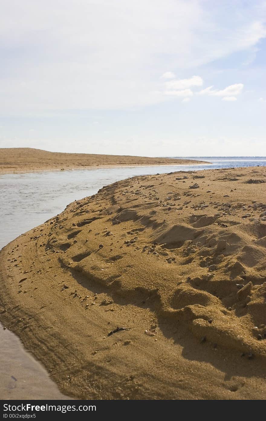 The beach shoreline during low tide