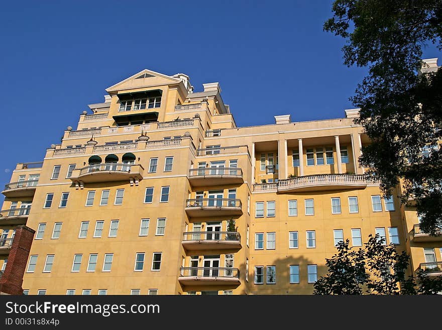 New nice stucco condominiums rising into a blue sky. New nice stucco condominiums rising into a blue sky