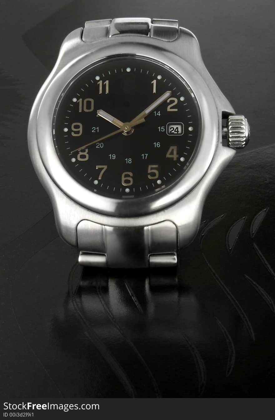 Iron watch over black background. Iron watch over black background