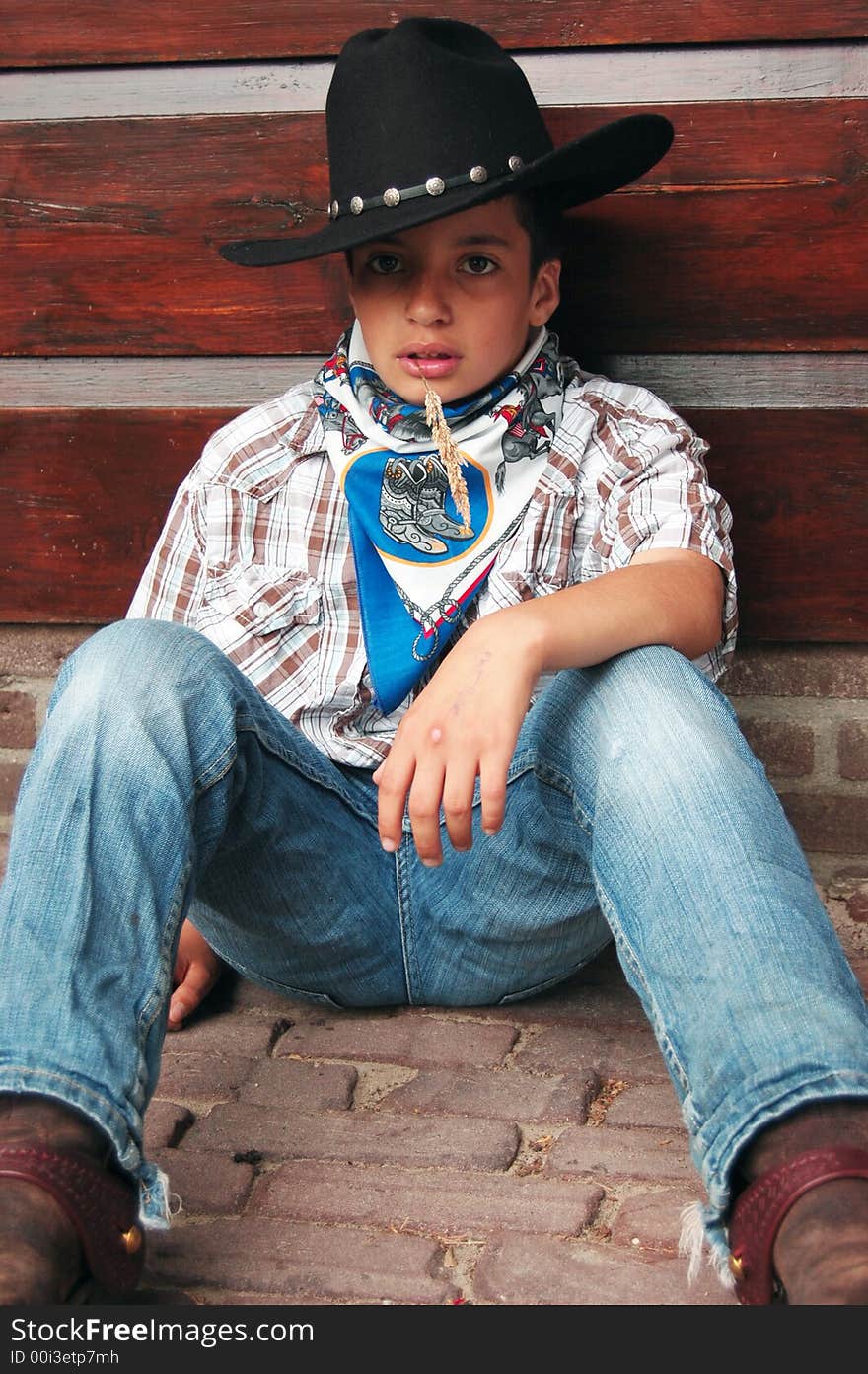 Little cowboy thinking about the world