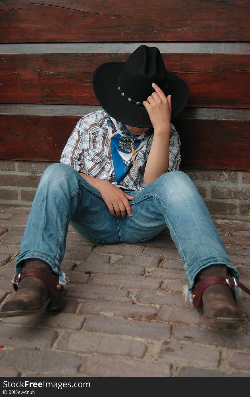 Little cowboy falling almost asleep