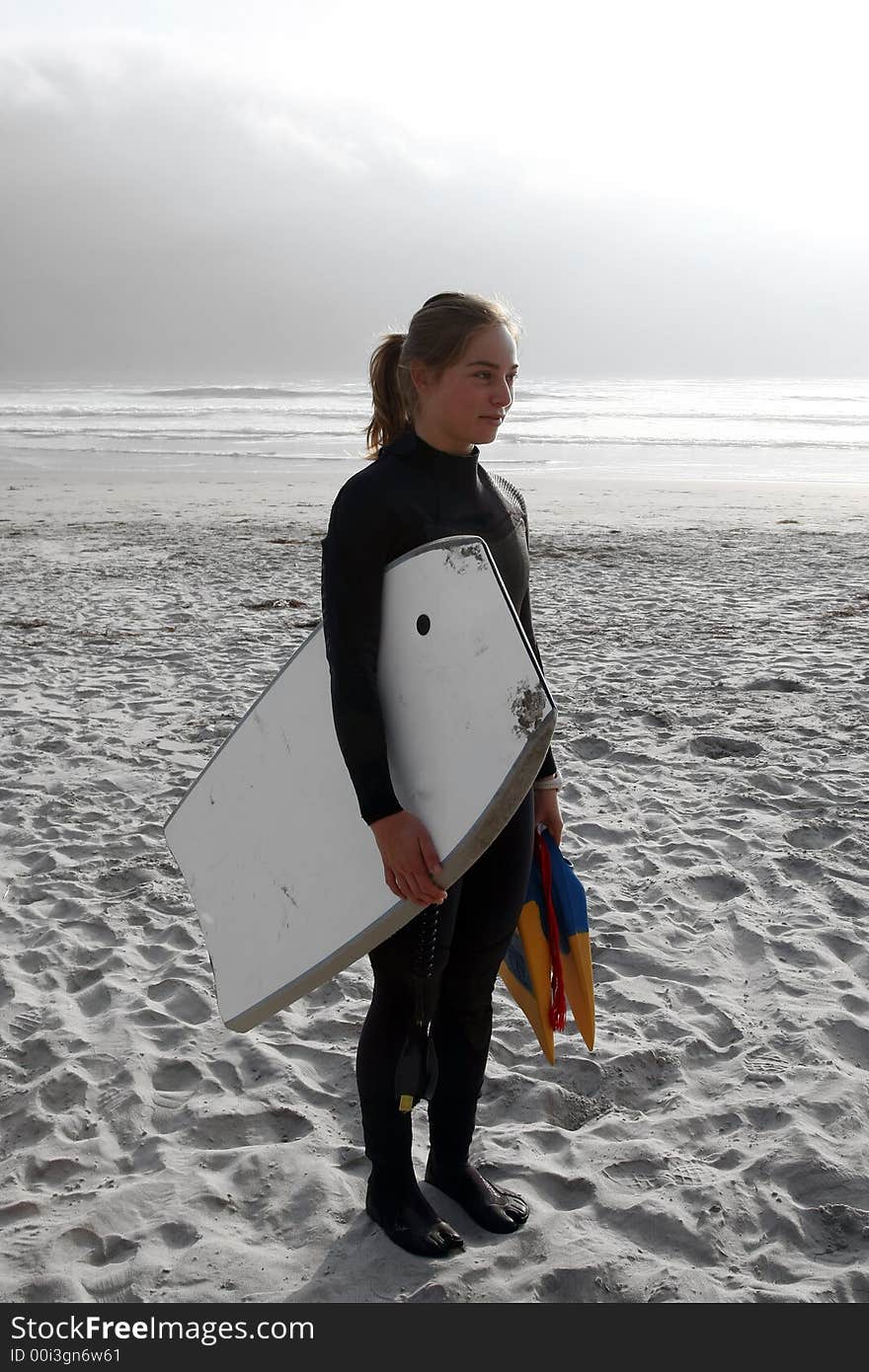 Body-boarder girl ready to go surfing. Body-boarder girl ready to go surfing