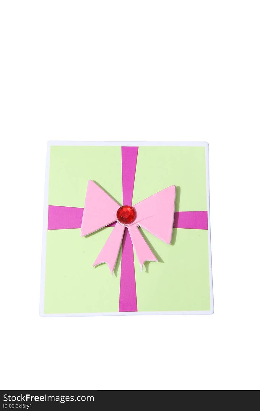 A paper cutout of a wrapped gift, isolated on white with clipping path. A paper cutout of a wrapped gift, isolated on white with clipping path