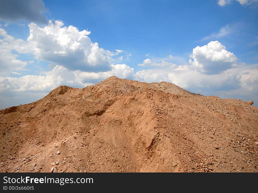 Sand embankment on background of sky. Sand embankment on background of sky