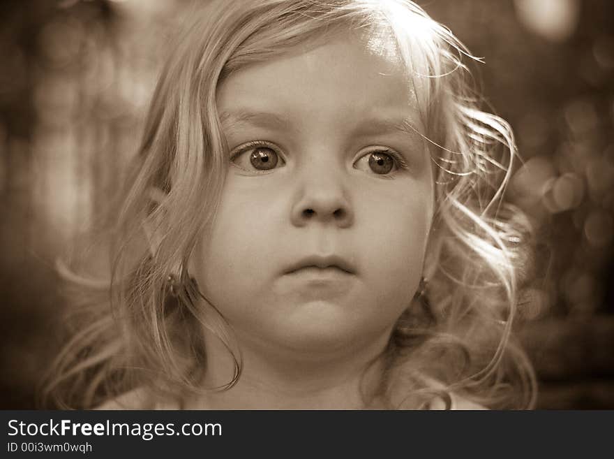 Young girl with big eyes and shining hair.