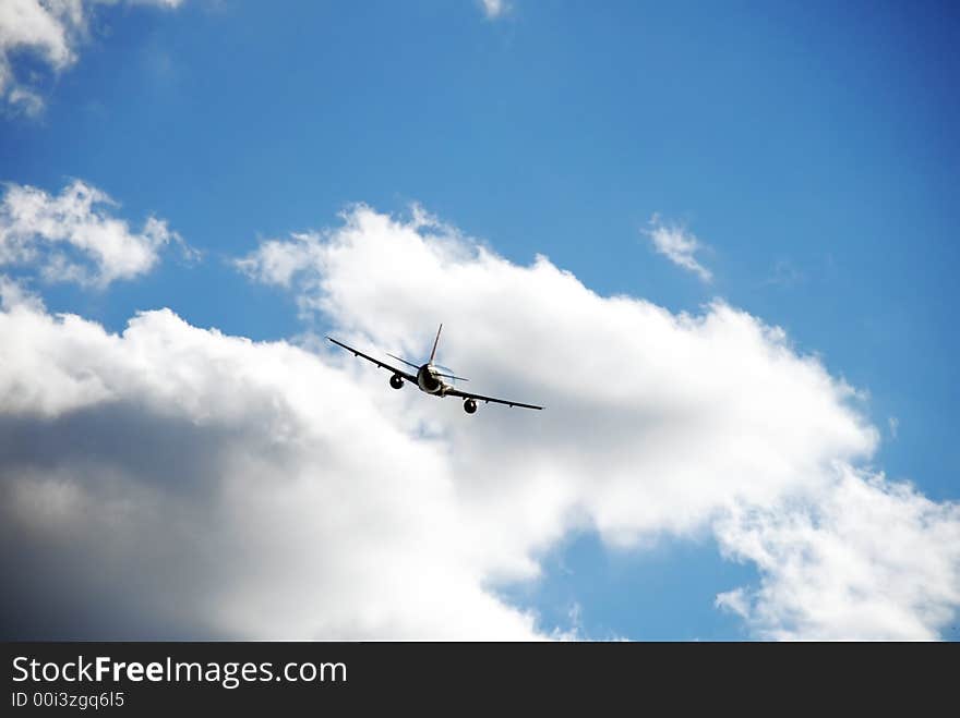 Jet plane on a nice blue sky with clouds. Jet plane on a nice blue sky with clouds