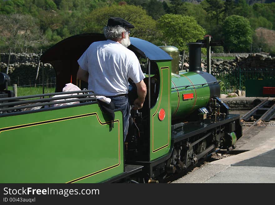 Narrow gauge steam train being driven on to the turntable ready for the return journey