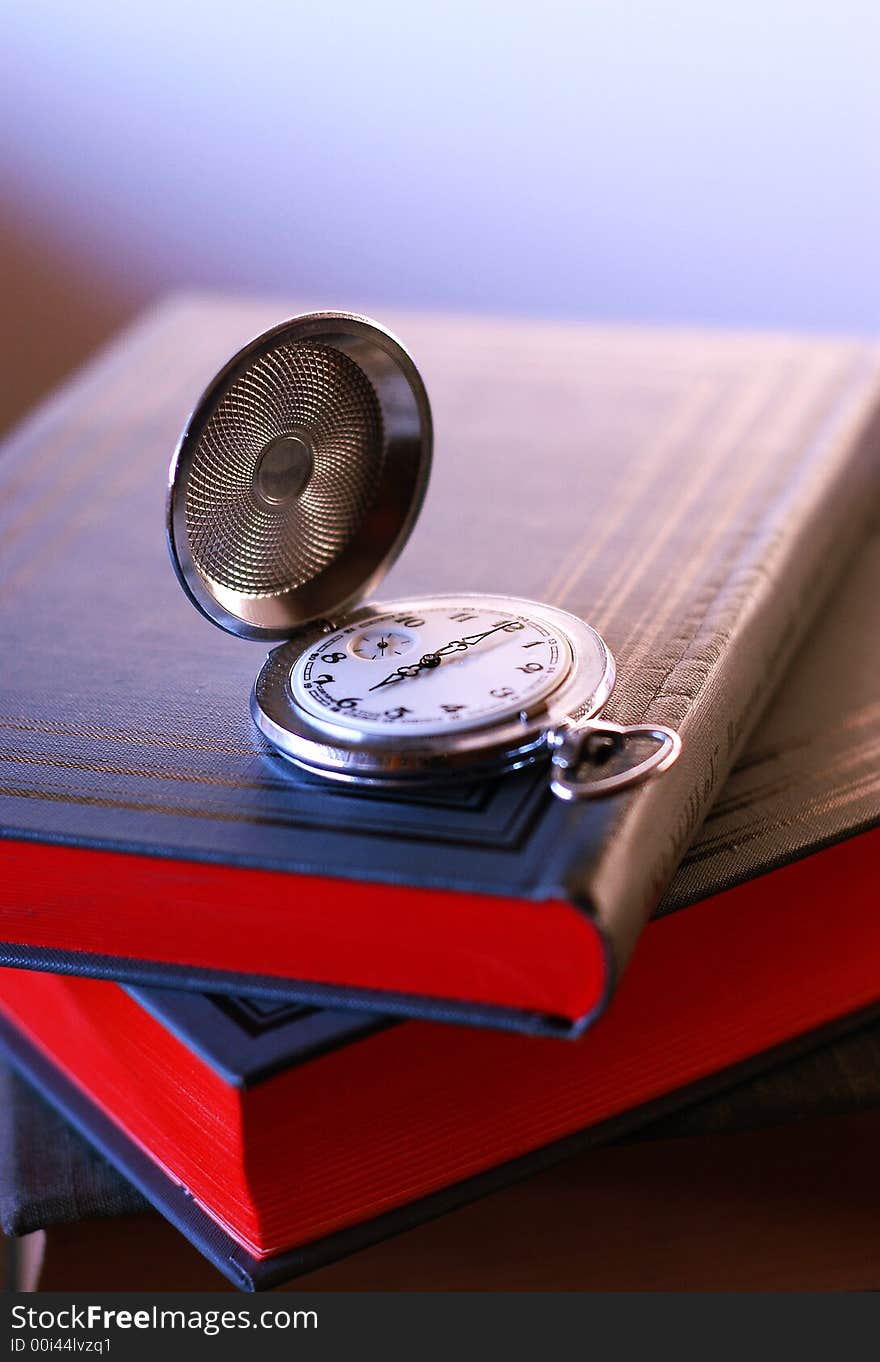 Photo old pocket watch on the book