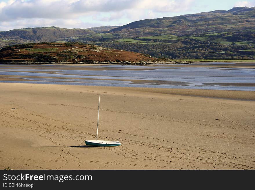 Deserted Boat on Sand at low tide