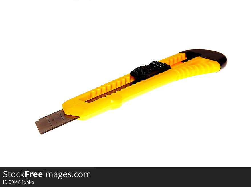 Yellow and black utility knife with break away blade isolated