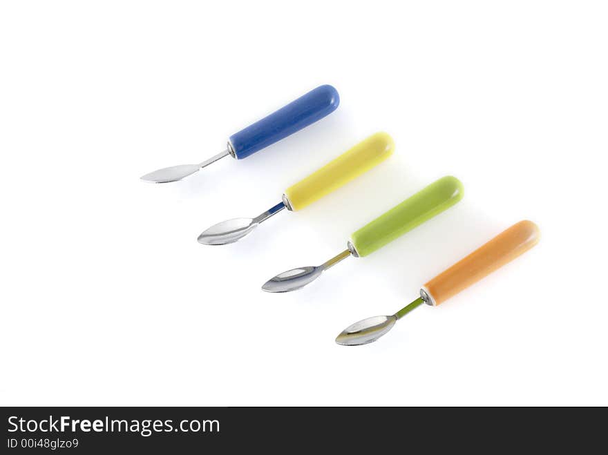 Four modern colored spoons in a row. Four modern colored spoons in a row