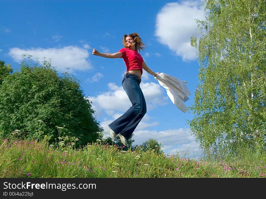 Beautiful lady jumping in summer landscape. Beautiful lady jumping in summer landscape