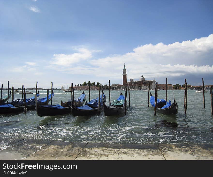 Gondolas in the water at Venice, Italy. Gondolas in the water at Venice, Italy