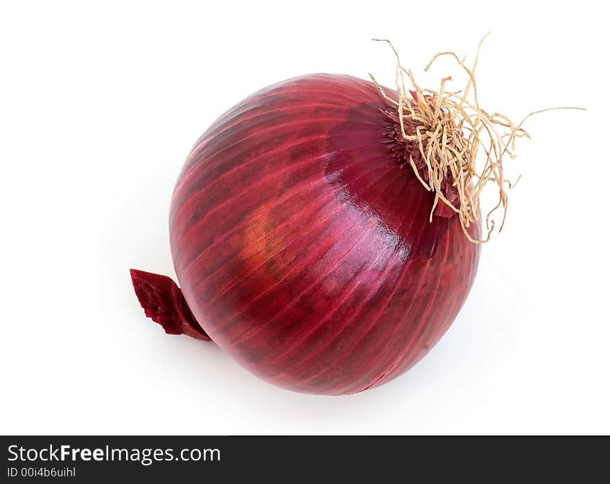 A raw red onion ready for preparation - on a white background.